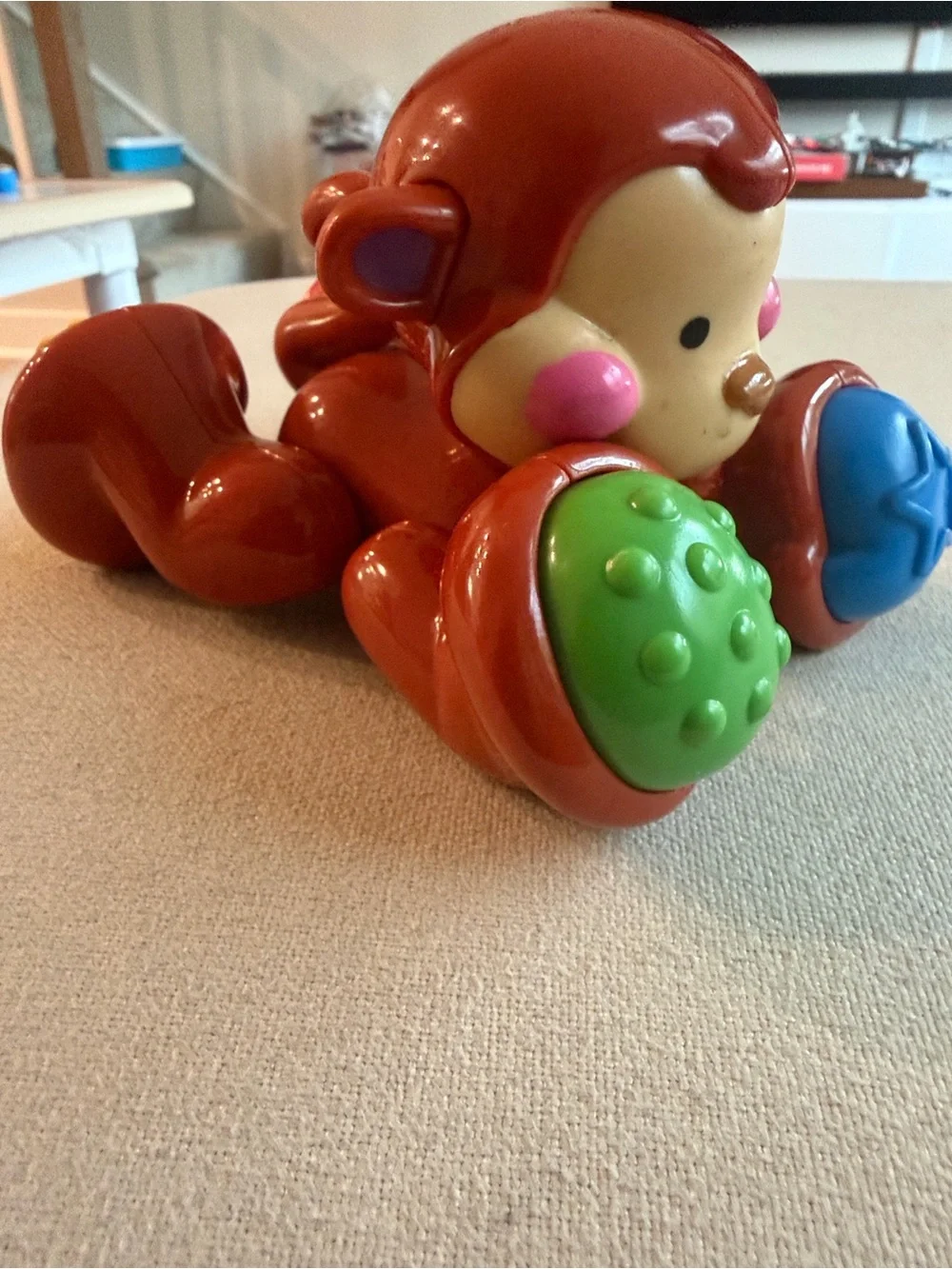 Fisher-Price Red Monkey Push Toy with Blue and Green Rollers